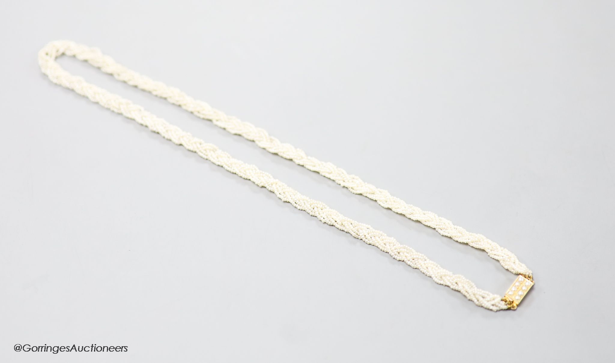 A 19th century 15ct and interwoven seed pearl choker necklace, 38cm.